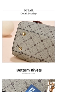 Detailed macro view of the handbag base showing protective gold metal studs and monogram pattern