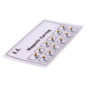 Set of 12 pairs of golden magnetic nose and ear studs on a display card