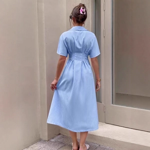 Back view of light blue striped shirt dress showing high waist silhouette and midi length