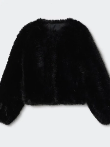 Detail shot of the plush black faux fur texture and wide sleeve cuff on the winter jacket