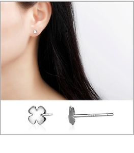 Detail view of S999 sterling silver four-leaf clover earrings with engraved hallmarks