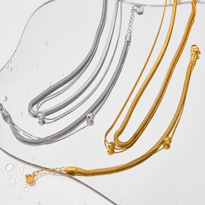 Double-layered flat snake chain necklace with round beads in gold and silver finish