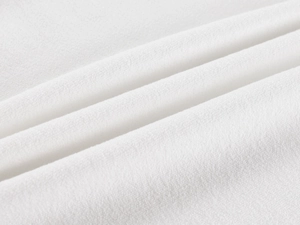 Close-up of the soft white knitted cotton fabric texture on the tennis polo shirt