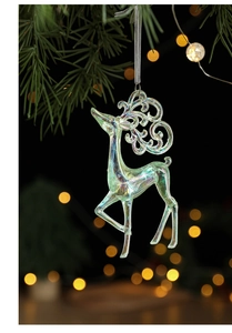 Iridescent reindeer Christmas hanging ornament with silk ribbon on a festive pine branch