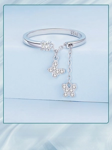 Detailed close-up of S925 sterling silver butterfly tassels and zircon stones on a ring