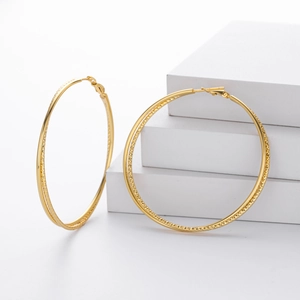 Polished S925 sterling silver golden hoop earrings with diamond-cut texture details