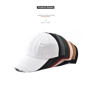 Multiple colors of distressed washed cotton baseball caps featuring vintage ripped details