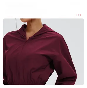 Close-up of wine red windproof sun protection jacket with drawstring waist and hooded design