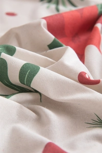 Detailed close-up of Christmas leaf pattern on white cotton linen rectangular tablecloth