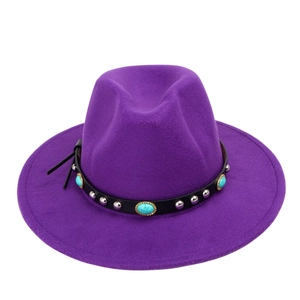 Detail of purple fedora hat with black leather band, silver studs and turquoise stones