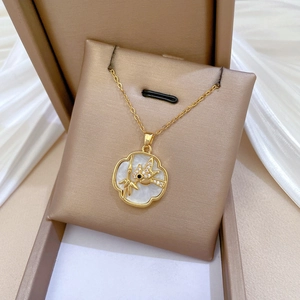 Golden titanium steel necklace with shell inlay and diamond bird pendant in a gift box