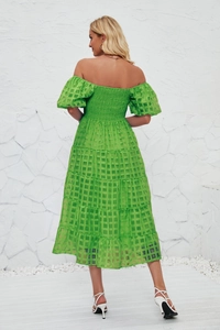 Back view of a tiered lime green maxi dress with smocking and mesh texture fabric