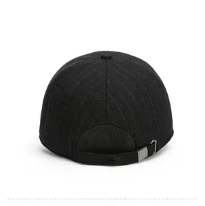 Detail view of the back of a wool baseball cap with an adjustable silver metal buckle