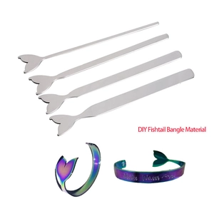 Macro view of DIY stainless steel fishtail bracelet materials and rainbow finish samples