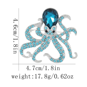 Macro view of blue rhinestone octopus brooch with size specifications and pin detail