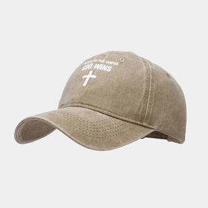 Detail of khaki washed cotton baseball cap with embroidered white cross and religious text