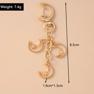 Detail view of gold moon star keychain showing 8.5cm total length and 7.4g weight specs