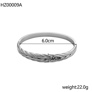 Detailed view of silver minimalist bangle with woven texture and 6.0cm inner diameter