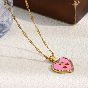 Pink enamel heart necklace with cherry motif and crystals on an 18K gold plated chain
