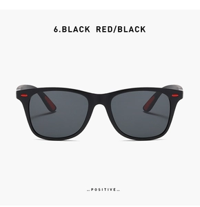 Front view of matte black polarized sports sunglasses with red decorative accents