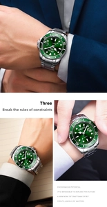 Close-up of luxury green business watch with stainless steel band and date window