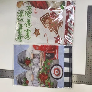 Detail of Christmas garden flags with gingerbread and gnome prints, sizing 30x45cm