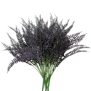 Detailed close-up of realistic black artificial Persian fern leaves with feathery texture