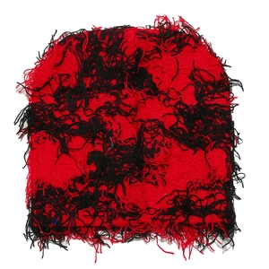 Detailed knit of red and black distressed balaclava with frayed street style texture