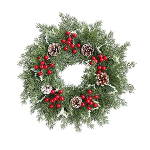 Christmas wreath with green pine needles, red berries and pine cones on white background