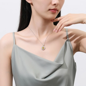 Elegant s925 silver sunflower necklace with yellow carbon diamond on a female model