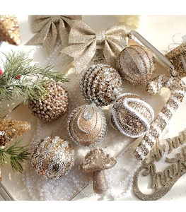 Detailed close-up of champagne gold and silver Christmas ornaments with sequins and beads