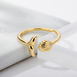 Adjustable 18k gold plated open ring featuring elegant whale tail and seashell motifs