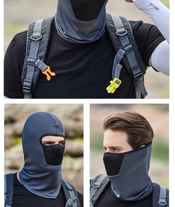 Detail of dark grey tactical face mask showing breathable honeycomb mesh and moisture-wicking fabric