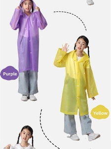 Detail of waterproof EVA children's raincoats in purple and yellow with button closure