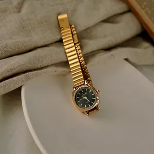 Retro women's gold watch with square green dial and minimalist metal mesh strap