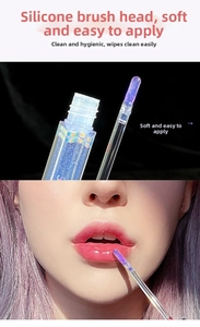 Macro detail of shimmer lip gloss with flexible silicone brush and water mirror effect