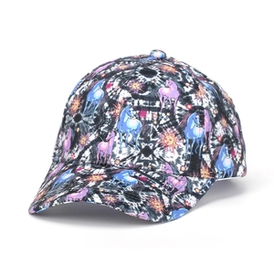 Detailed close-up of unicorn and sun prints on a tie-dye patterned baseball cap
