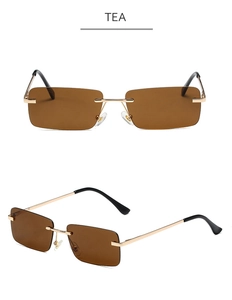 Detail view of tea-colored rimless rectangular sunglasses with gold metal temples