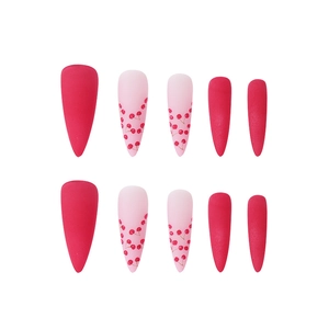Long stiletto press-on nails featuring matte hot pink and cute cherry print patterns