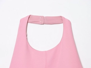 Detail of neck closure and stitching on a pink halter neck backless dress for women