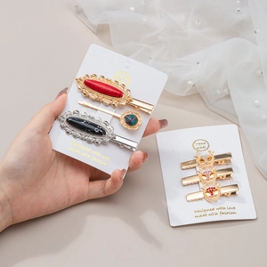 Elegant gold-tone hair clip sets with turquoise, marble resin, and sparkling crystals