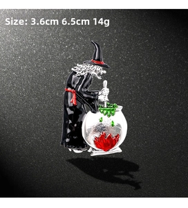 Detail view of witch cauldron brooch showing 3.6cm x 6.5cm dimensions and enamel finish