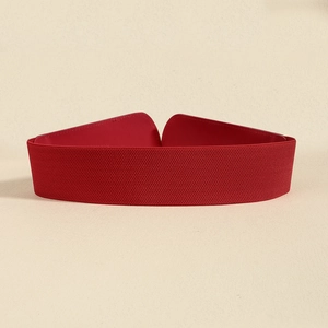 Macro shot of red elastic wide belt featuring premium textured leatherette closure detail
