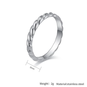 Macro detail of 3mm wide silver twist ring in stainless steel with weight specification