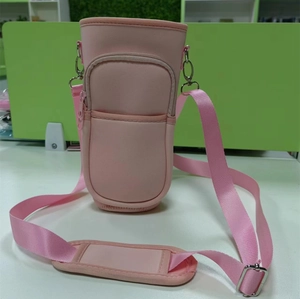 Close-up of pink neoprene 40oz tumbler carrier with adjustable strap and storage pouch