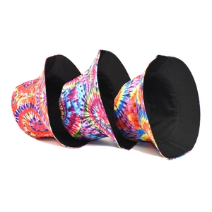 Vibrant rainbow tie-dye reversible bucket hats with minimalist black inner lining