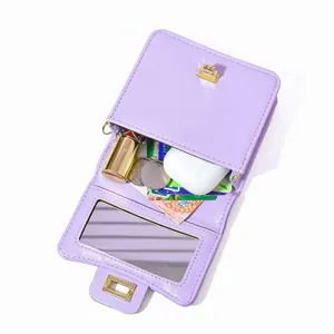 Light purple faux leather crossbody bag with built-in mirror and functional interior