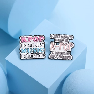 K-pop enamel pins set with inspirational slogans in pink and blue on geometric stands