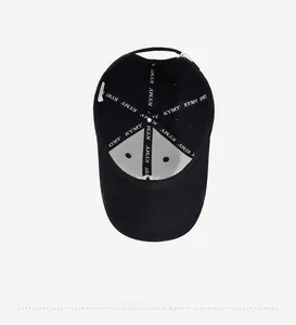 Detail view of cotton baseball cap interior featuring reinforced stitching and metal buckle