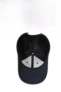 Internal structure of navy baseball cap featuring breathable mesh and reinforced stitching
